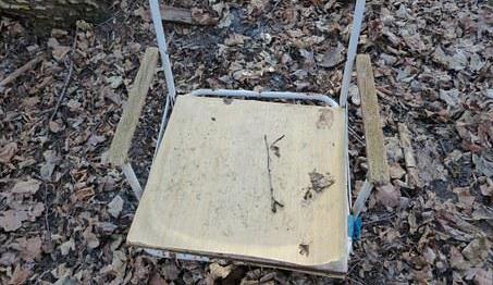 Old camping chair covered in mold